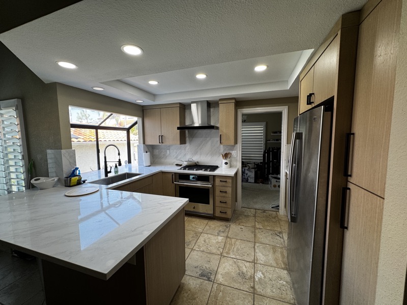 Bright white kitchen with a large island and seating