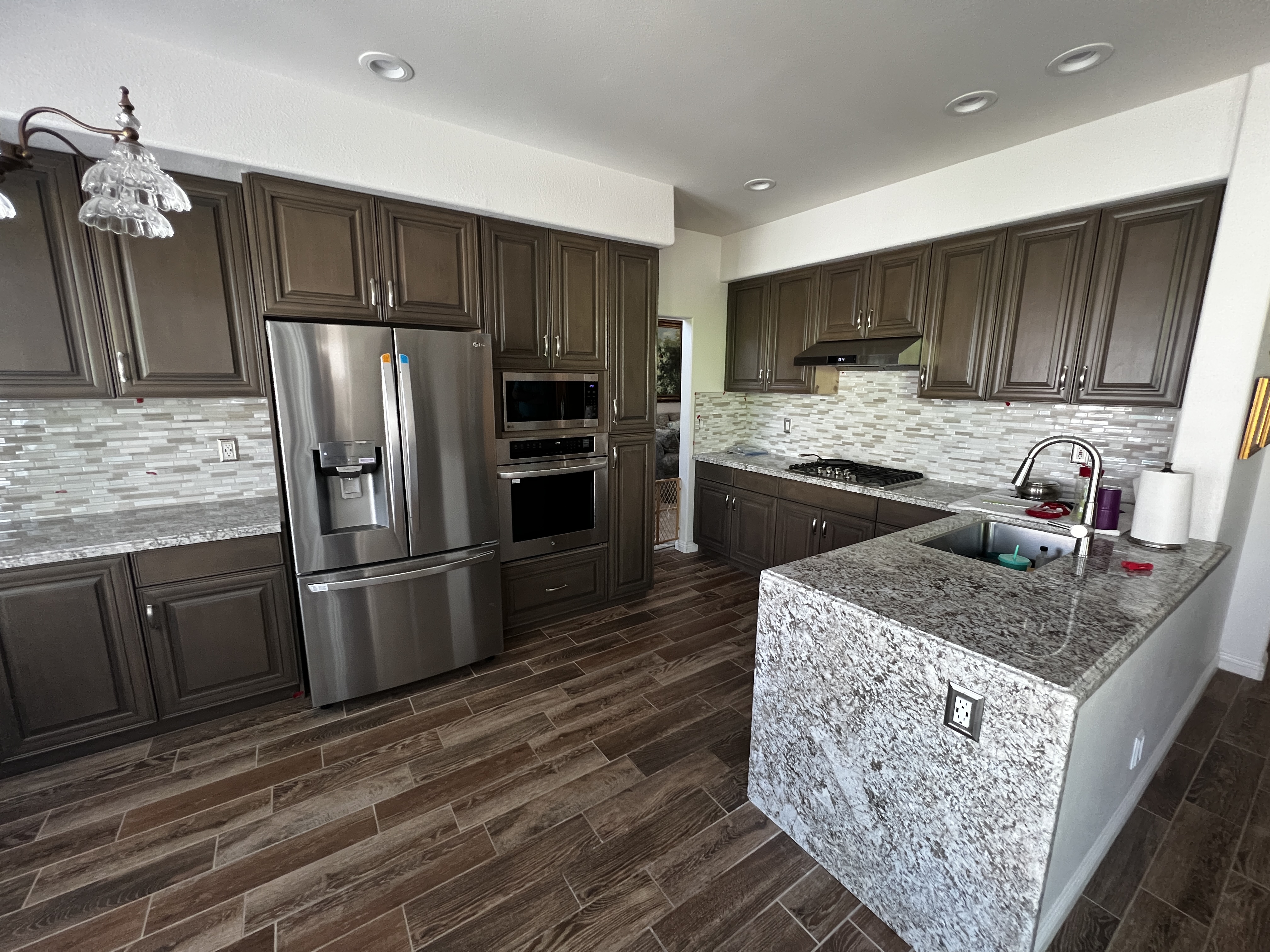 Dark wood kitchen cabinetry and island fronts