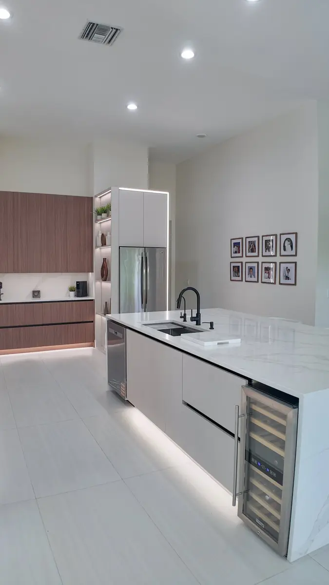 Close view of built-in island storage with a beverage refrigerator
