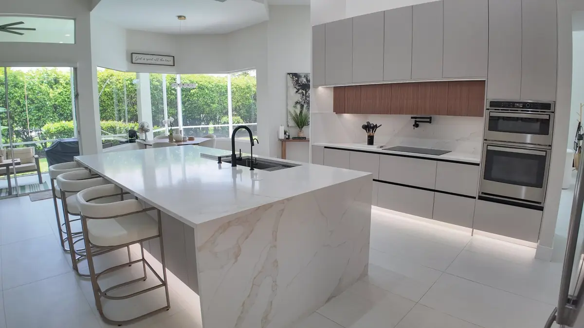 Kitchen island with counter stools pulled up for seating