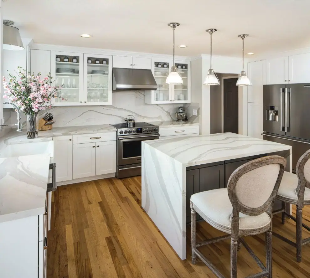 Kitchen island with a stone waterfall end panel