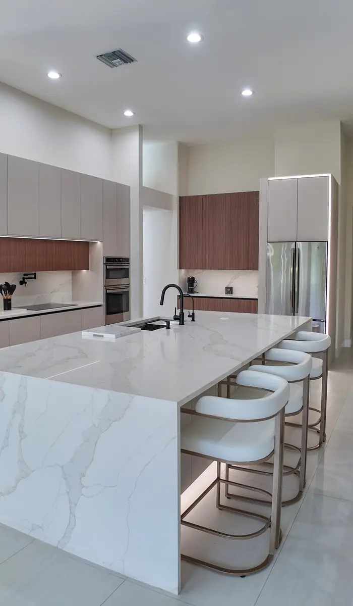 Island with waterfall edge and seating along its length