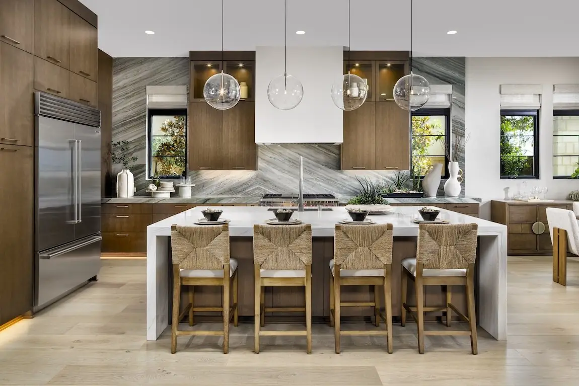 Large kitchen island with waterfall countertop and seating