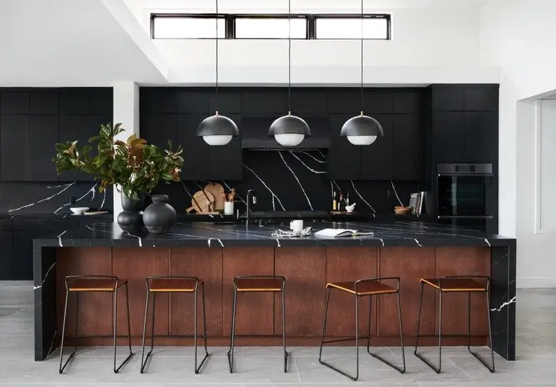 Navy blue kitchen island with a light countertop
